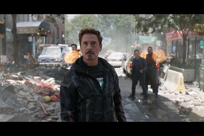 Tony Stark/Iron Man (Robert Downey Jr.) w/ Doctor Strange (Benedict Cumberbatch), Bruce Banner (Mark Ruffalo) and Wong (Benedict Wong) in the background. Photo: Film Frame.