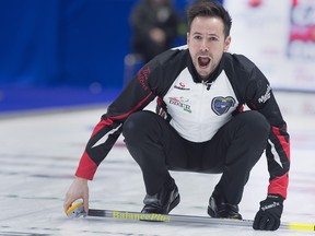 Ontario skip John Epping directs the sweep against Team Canada in the 1 vs 2 playoff at the Tim Hortons Brier at the Brandt Centre in Regina on Saturday, March 10, 2018. THE CANADIAN PRESS/Andrew Vaughan