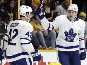 Toronto Maple Leafs winger James van Riemsdyk (25) and Tyler Bozak (42) celebrate after a goal against the Nashville Predators Thursday, March 22, 2018, in Nashville, Tenn. (AP Photo/Mark Humphrey)