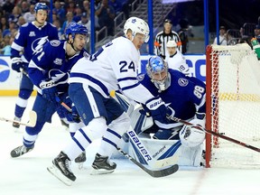Maple Leafs froward Kasperi Kapanen tries to control the puck against the Tampa Bay Lightning on Tuesday night  at Amalie Arena.  (Getty Images)