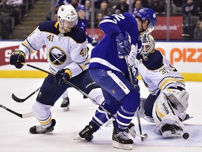 Toronto Maple Leafs centre Patrick Marleau (12) scores against Buffalo Sabres goaltender Chad Johnson (31) as defenceman Justin Falk (41) defends during second period NHL hockey action in Toronto on Monday, March 26, 2018. (THE CANADIAN PRESS/Frank Gunn)