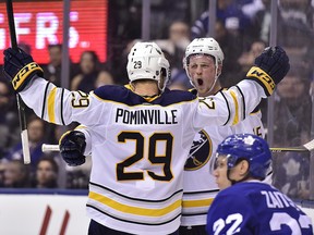 Buffalo Sabres centre Jack Eichel (15) celebrates his goal against the Toronto Maple Leafs with right wing Jason Pominville (29) in Toronto on Monday, March 26, 2018. (THE CANADIAN PRESS/Frank Gunn)