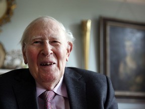 In this photo taken Monday, April 28, 2014, Roger Bannister, who as a young man was the first person to break the 4-minute barrier for the mile run in 1954, poses during an interview with The Associated Press at his home in Oxford, England.