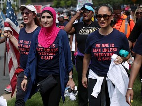 Womens March founder Linda Sarsour, pink hijab, is under fire for allegedly covering up sexual abuse in her office.   (Alex Wong/Getty Images)