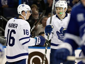 Toronto Maple Leafs' James van Riemsdyk celebrates his goal against the Tampa Bay Lightning with Mitchell Marner on March 20, 2018