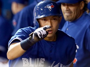 Munenori Kawasaki of the Toronto Blue Jays celebrates a run during MLB action against the New York Yankees at the Rogers Centre on April 21, 2013
