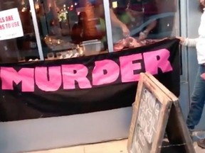 Michael Hunter, owner of the Antler Kitchen & Bar in Toronto, has seen an uptick in business after he butchered a deer leg in front of a group of animal-rights activists who have been protesting his restaurant since December. (Video screenshot via The West Australian)