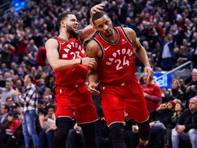 Toronto Raptors guard Fred VanVleet congratulates teammate Norman Powell during NBA action against the Minnesota Timberwolves on Jan. 30, 2018