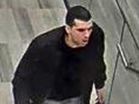 Security camera image of a man wanted in the theft of a Rolex valued at more than $15,000 from a Toronto store on March 7, 2018