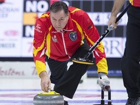 Nunavut skip David St. Louis delivers a rock as they play Northern Ontario at the Tim Hortons Brier curling championship at the Brandt Centre in Regina on Sunday, March 4, 2018. THE CANADIAN PRESS/Andrew Vaughan