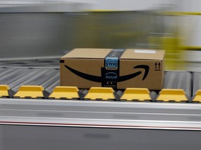 In this Feb. 9, 2018, file photo, a box for an Amazon prime customer moves through the new Amazon Fulfillment Center in Sacramento, Calif.