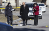 A day after Nnamdi Ogba was gunned down on Scarlettwood Ct., in Etobicoke, Toronto Police investigate the deadly shooting on Saturday, March 17, 2018.