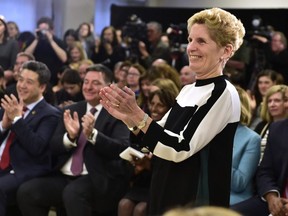 Ontario Premier Kathleen Wynne applauds staff and patients during a CAMH mental health funding announcement in Toronto on Wednesday March 21, 2018.