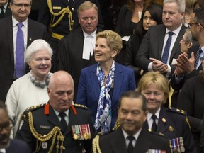 Ontario Lt.-Governor Elizabeth Dowdeswell, left, and Ontario Premier Kathleen Wynne enter the legislative chamber before the throne speech at Queens Park, in Toronto on Monday, March 19, 2018. THE CANADIAN PRESS/Chris Young