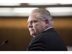 Ontario PC Leader Doug Ford takes questions from journalists during a pre-budget lock-up as the Ontario Provincial Government prepares to deliver its 2018 Budget at the Queens Park Legislature in Toronto on Wednesday, March 28, 2018.