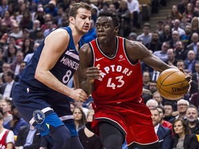 Minnesota Timberwolves forward Nemanja Bjelica (8) guards Toronto Raptors forward Pascal Siakam (43) as he goes to the net in Toronto on Tuesday, Jan. 30, 2018. (THE CANADIAN PRESS/Christopher Katsarov)