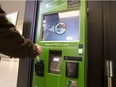 TORONTO, ONTARIO: DECEMBER 6, 2016--PRESTO--People use Presto Pass reload card machines at Toronto's Union Station, Tuesday December 6, 2016. The machines have not been working 40% of the time.                                                                                                                                                                                                                                                                                                                                                  [Photo Peter J Thompson] [For National story by Chris Selley/National] //NATIONAL POST STAFF PHOTO ORG XMIT: POS1612061648347256  //  1208 col selley
