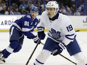 Toronto Maple Leafs centre Tomas Plekanec (19) skates in front of Tampa Bay Lightning centre Steven Stamkos (91) Monday, Feb. 26, 2018, in Tampa, Fla. (AP Photo/Chris O'Meara)