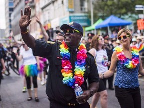 Toronto Police chief Mark Saunders marches during the annual Pride parade in Toronto on July 3, 2016. THE CANADIAN PRESS/Mark Blinch