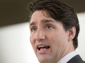 Prime Minister Justin Trudeau speaks to the media during a visit to Cuisine-Atout, a Montreal-based catering service that employs people who have not completed their secondary education, in Montreal on Thursday March 1, 2018.