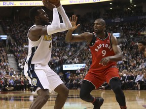 Serge Ibaka guards against Denver Nuggets Paul Millsap in the second half at the Air Canada Centre on March 27, 2018