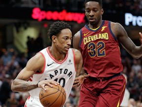 Toronto Raptors' DeMar DeRozan drives against Cleveland Cavaliers' Jeff Green during NBA action on March 21, 2018
