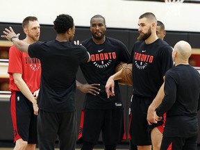 DeMar DeRozan (facing away) talks with teammates during Raptors practice at the BioSteel Centre in Toronto on Friday March 30, 2018. (Veronica Henri/Toronto Sun)