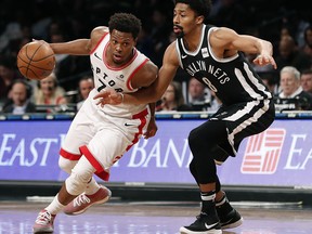 Brooklyn Nets guard Spencer Dinwiddie (8) defends against Toronto Raptors guard Kyle Lowry (7), who drives to the basketTuesday, March 13, 2018, in New York. (AP Photo/Kathy Willens)