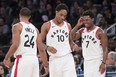 Toronto Raptors guard DeMar DeRozan (10), forward Norman Powell (24) and guard Kyle Lowry (7) react during the final minutes of the second half of an NBA basketball game, Sunday, March 11, 2018, at Madison Square Garden in New York. The Raptors won 132-106. AP