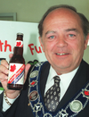 Durham Region chairman Roger Anderson is seen here in 1998 holding a bottle of specially brewed Durham’s Own 25th anniversary beer.