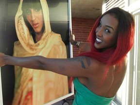 Activist Sumaya Dalmar holds a photograph taken by Ryerson documentary media graduate and multidisciplinary artist Abdi Osman in this undated handout photo. A Toronto university has launched a scholarship to help support racialized transgender students in honour of a young woman who died several years ago. THE CANADIAN PRESS/HO-Abdi Osman