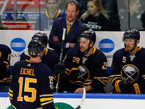 Buffalo Sabres centre Jack Eichel talks to head coach Phil Housley during an NHL game against the Montreal Canadiens on Oct. 5, 2017