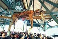 This picture taken on March 4, 2018 shows the carcass of a Sumatran tiger hung from a ceiling as villagers gather underneath at Hatupangan village in North Sumatra. 
Villagers in a remote Indonesian community disemboweled a critically endangered Sumatran tiger and then hung the big cat from a ceiling after it attacked a pair of locals, a conservation official said March 5.