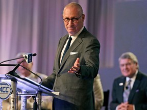 In this July 21, 2016 file photo, ESPN president John Skipper gestures as he talks about the new ACC/ESPN Network during a news conference at the Atlantic Coast Conference Football Kickoff in Charlotte, N.C.