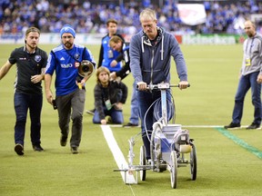 Grounds crew make last-minute adjustments delaying the start of the Eastern Conference final between the Montreal Impact and Toronto FC in 2016. (THE CANADIAN PRESS)