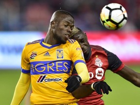 Toronto FC defender Chris Mavinga (23) and UANL Tigres forward Enner Valencia (13) vie for the header during first half CONCACAF Champions League quarter-final action, in Toronto on Wednesday, March 7, 2018. THE CANADIAN PRESS/Frank Gunn