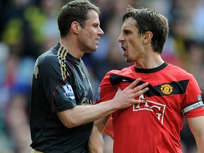 Liverpool’s Jamie Carragher, left, argues with Gary Neville of Manchester United on March 21, 2010, in Manchester, England