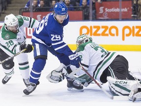 Dallas Stars goaltender Kari Lehtonen (32) makes a save on Toronto Maple Leafs centre William Nylander (29) as Stars defenceman Stephen Johns (28) skates in Wednesday, March 14, 2018 at the ACC. (THE CANADIAN PRESS/Chris Young)