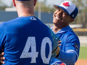 Toronto Blue Jays pitcher Marcus Stroman jokes with pitching coach Pete Walker at spring training in Dunedin on Feb. 20, 2018