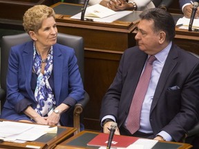 Ontario Premier Kathleen Wynne and Provincial Finance Minister Charles Sousa attend the Throne Speech at the Ontario Legislature in Toronto on Monday, March 19, 2018.