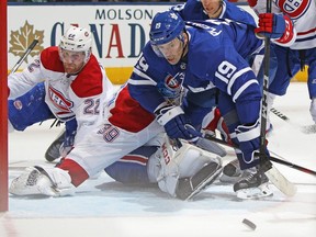 Maple Leafs forward Tomas Plekanec, right, tries to get a puck past Canadiens goaltender Charlie Lindgren, 39, during NHL action in Toronto on Saturday, March 17, 2018.