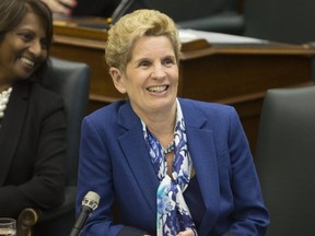 Premier Kathleen Wynne listens to her throne speech being delivered by Lt.-Gov. Elizabeth Dowdeswell at Queen's Park in Toronto, Ont. on Monday, March 19, 2018.