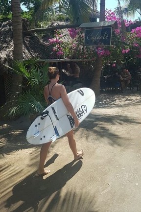 A surfer walks down the road near Playa Zicatela. The spot is famous for its waves dubbed the Mexican Pipeline and its annual surf competition. SARAH DOKTOR/POSTMEDIA NETWORK