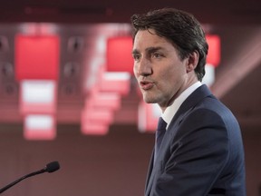 Prime Minister Justin Trudeau delivers a speech at a party fund raiser Wednesday, March 28, 2018 in Montreal.