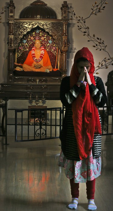 The Hare Krishna Temple holds a service by opening windows inside a grand hall and displaying marble Krishna Deities on Wednesday February 28, 2018. Veronica Henri/Toronto Sun