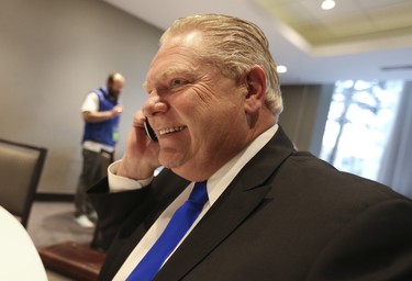 PC candidate Doug Ford on the phone at the  Ontario PC leadership convention on Saturday March 10, 2018. Jack Boland/Toronto Sun/Postmedia Network