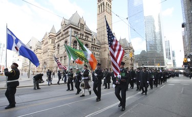 Toronto Professional Fire Fighters Association band and members on Queen St .W. near old city hall at the Toronto St Patrick's Day parade on Sunday March 11, 2018. Jack Boland/Toronto Sun/Postmedia Network