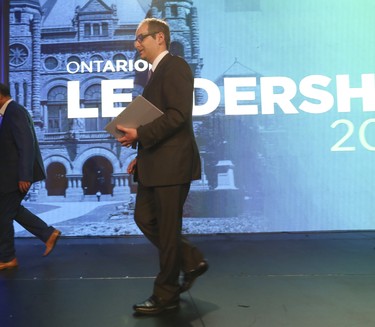 Hartley Lefton,  chair of the Leadership Organizing Committee, leaves the stage after telling supporters to go home as votes were still being assessed  at the Ontario PC leadership convention on Saturday March 10, 2018. Jack Boland/Toronto Sun/Postmedia Network