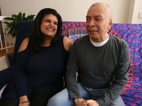 Noora Sagarwala (L) sits with Francisco Molina who almost died on the College Street subway platform on Feb. 12 after being randomly targeted by a man who rammed an ice pick up through his nose hitting his left optic nerve and piercing his brain. A Go Fund me page has been set up by his "angel" Sagarwala to help him with medical expenses  on Wednesday March 14, 2018. (Jack Boland/Toronto Sun/Postmedia Network)