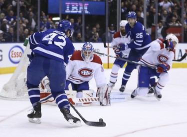 Montreal Canadiens Charlie Lindgren D (39) makes a point blank glove save on Toronto Maple Leafs Tyler Bozak C (42) during the first period in Toronto on Saturday March 17, 2018. Jack Boland/Toronto Sun/Postmedia Network